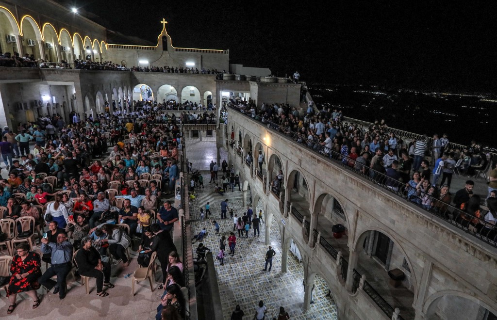 Iraqi Orthodox Christians celebrate Easter Saturday at the church of the ancient Mar Matta monastery of Saint Matthew in the village of Bashiqa, April 23, 2022. (Photo: Safin Hamed/AFP)