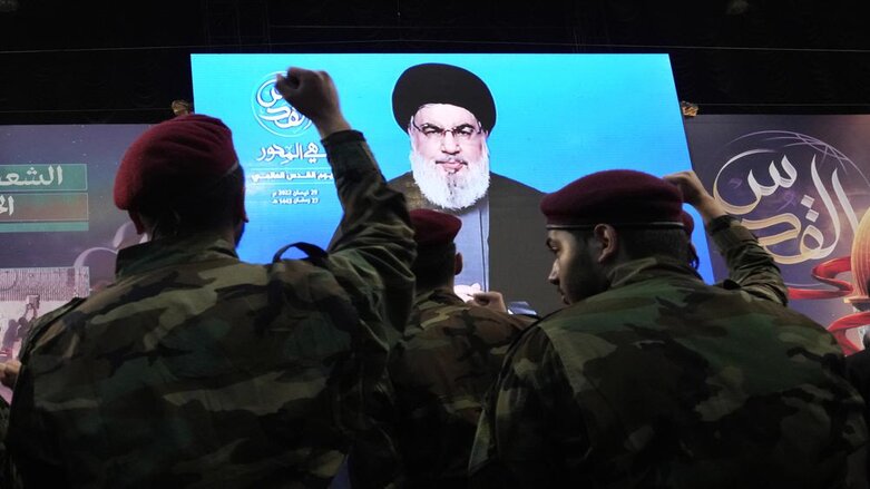 Hezbollah fighters raise their hands as their leader Sheik Hassan Nasrallah speaks via a video link during a rally to mark Jerusalem day or Al-Quds day, in a southern suburb of Beirut, Lebanon, Friday, April 29, 2022. (Photo: Hassan Ammar/A