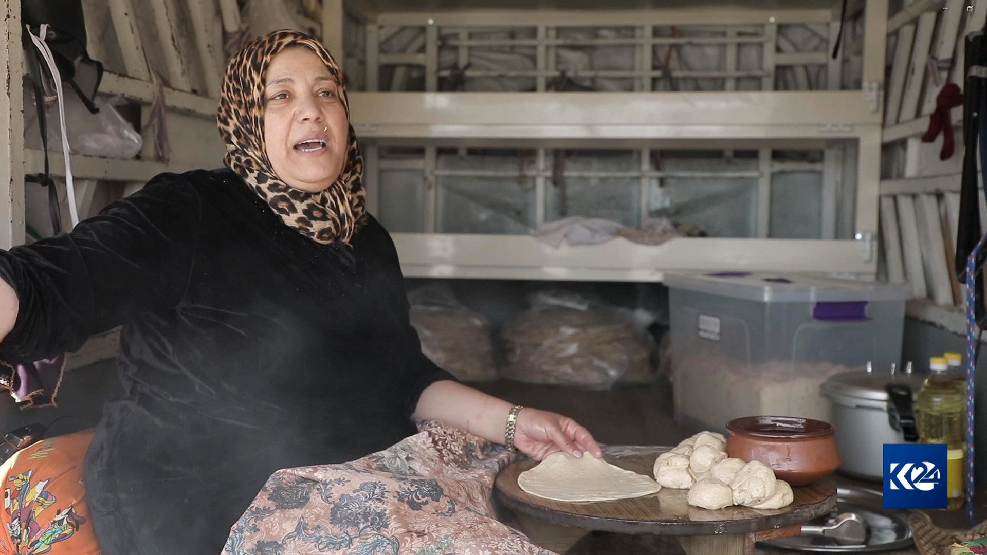 Shokhan Nasradin is bakin at the back of her KIA truck, which she had turned into a mobile kitchen, in Sulaimani, April 8, 2023. (Photo: Kurdistan 24)