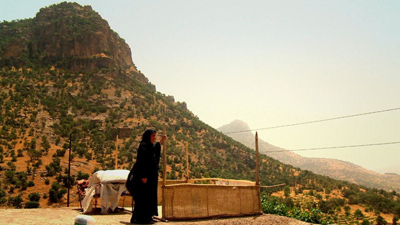 Aisha Taha Abdulla, a survivor of the Balisan Valley chemical attack in 1987, is pictured in her village. (Photo: Courtesy of Kurdish Memory Programme) 
