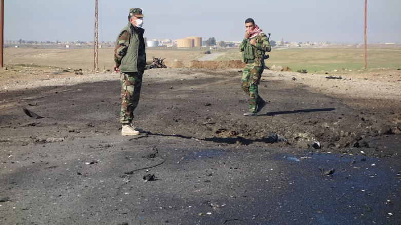 Kurdish peshmerga fighters survey the damage after an ISIS suicide truck loaded with chlorine gas tanks exploded near Mosul in January 2015 (Photo: KRG)