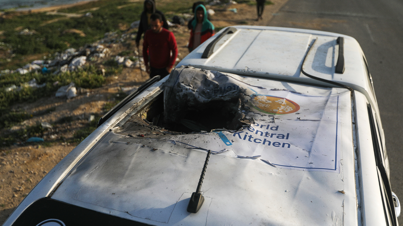 Palestinians inspect a vehicle with the logo of the World Central Kitchen wrecked by an Israeli airstrike in Deir al Balah, Gaza Strip, Tuesday, April 2, 2024.  (Photo: AP Ismael Abu Dayyah)