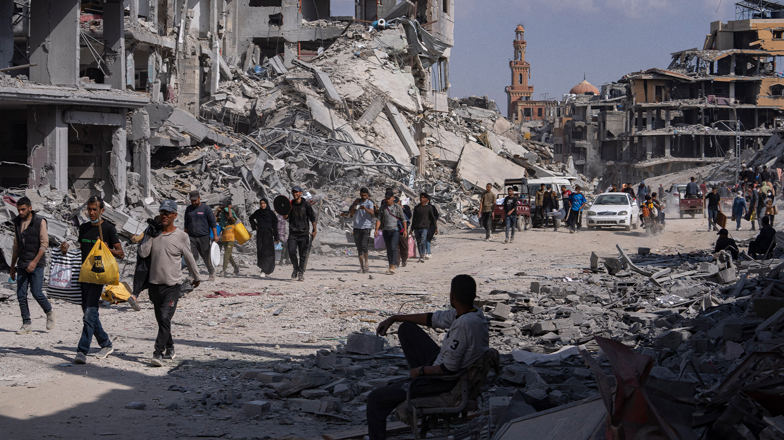 Palestinians walk through the destruction in the wake of an Israeli air and ground offensive in Khan Younis, southern Gaza Strip, Monday, April 8, 2024. (Photo: AP/Fatima Shbair)