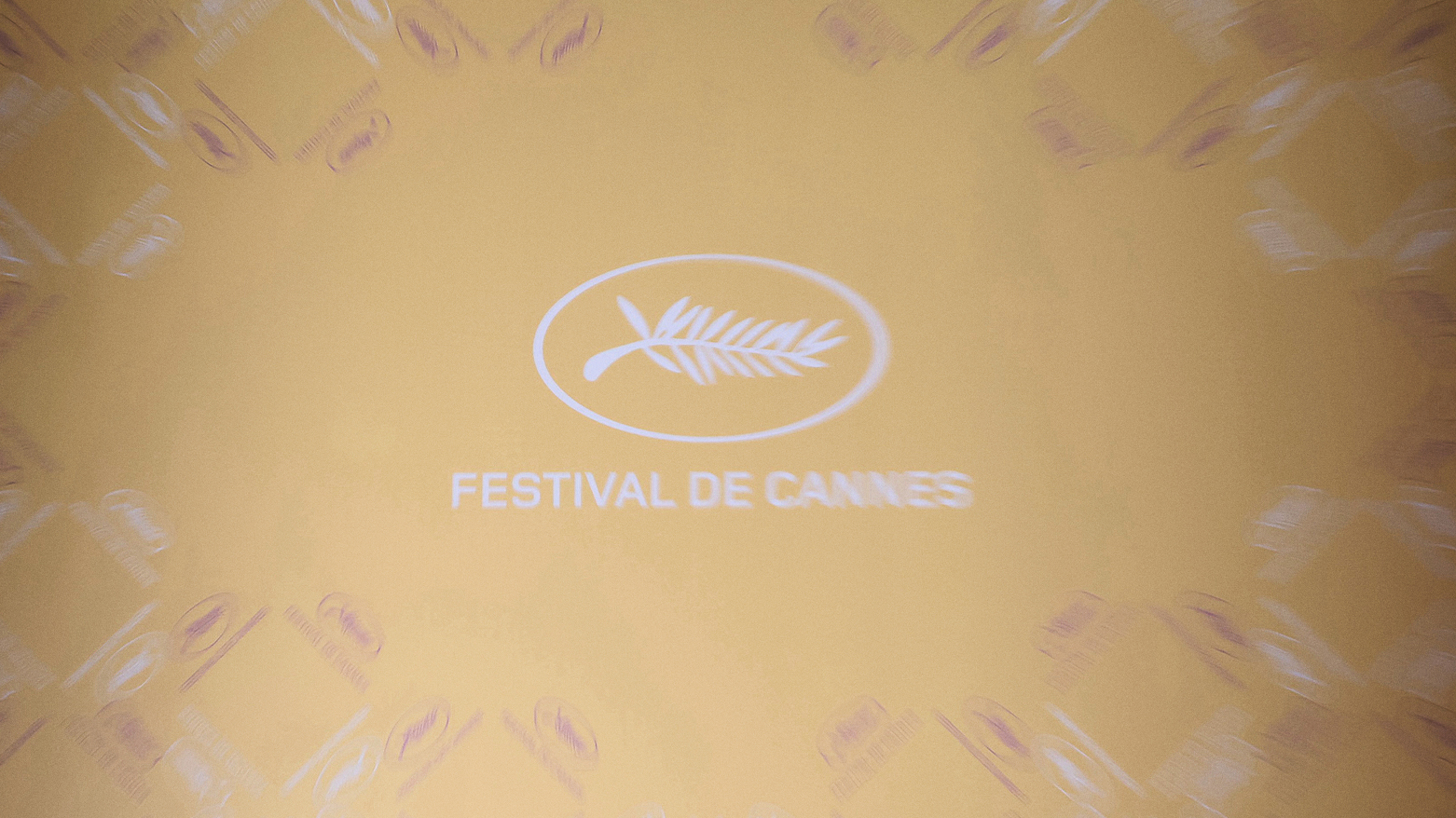 A photo shows the festival logo ahead a press conference to announce the official selection of the 77th edition of the Cannes Film Festival. (Photo: Alain JOCARD / AFP)