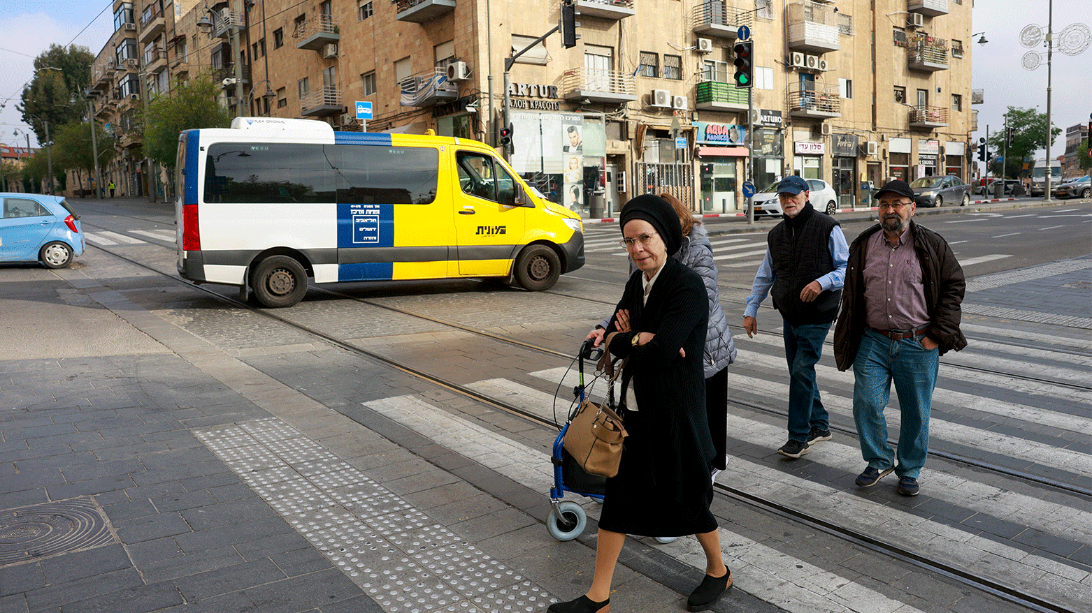 People cross a street in Jerusalem on April 14, 2024. Iran's unprecedented attack on Israel has been "foiled," the Israeli army announced on April 14. (Photo: AFP)