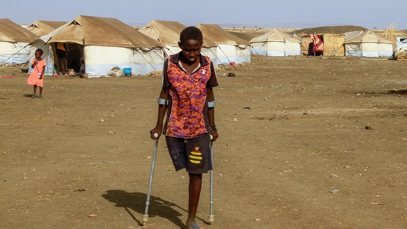 A picture taken on March 20, 2024, shows children who fled Khartoum and Jazira states in war-torn Sudan standing near tents at a camp for the internally displaced in southern Gadaref state. (Photo: AFP)