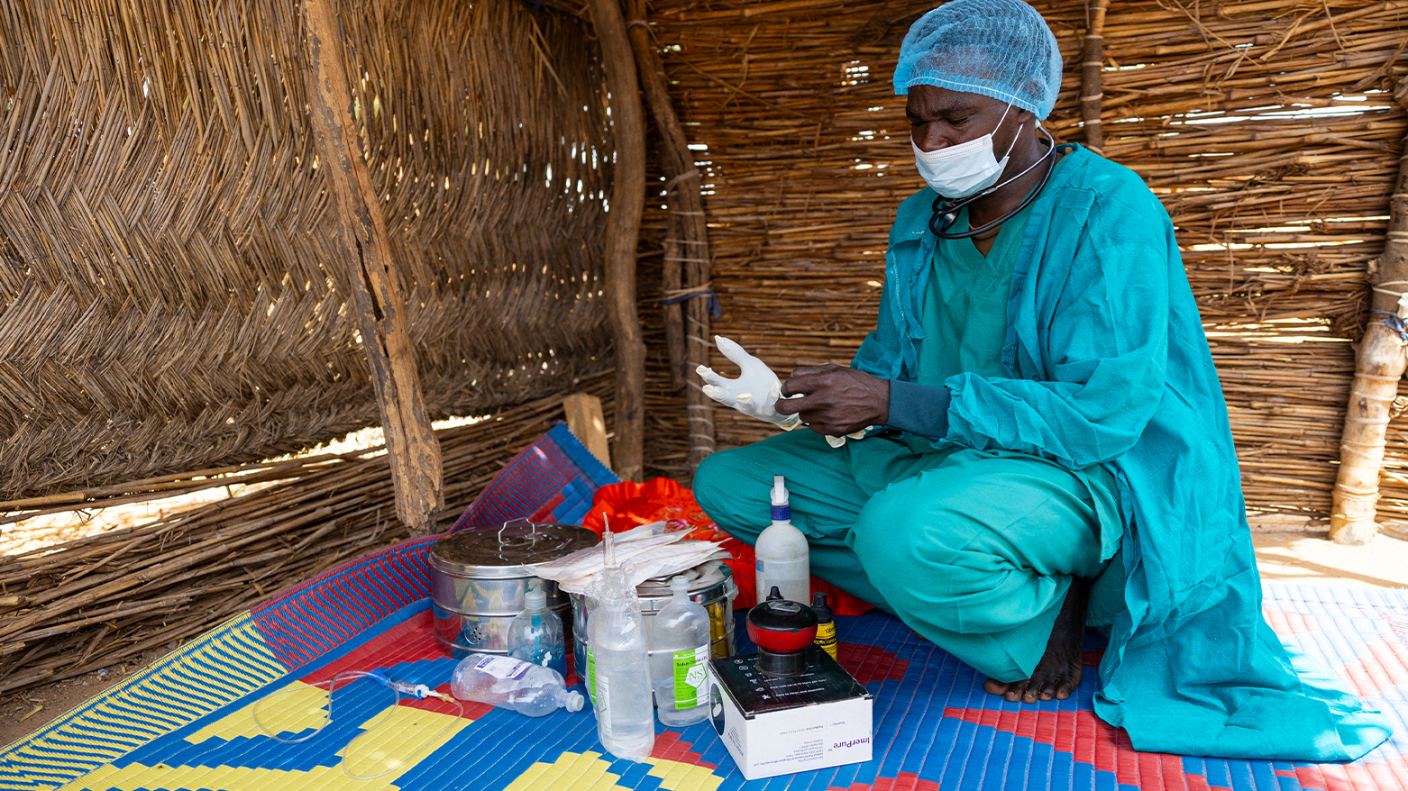 36-year-old doctor and Sudanese refugee Yassin Ishag Dawod gets ready for a surgical procedure in the Farchana refugee camp, on April 8, 2024.  (Photo: AFP)