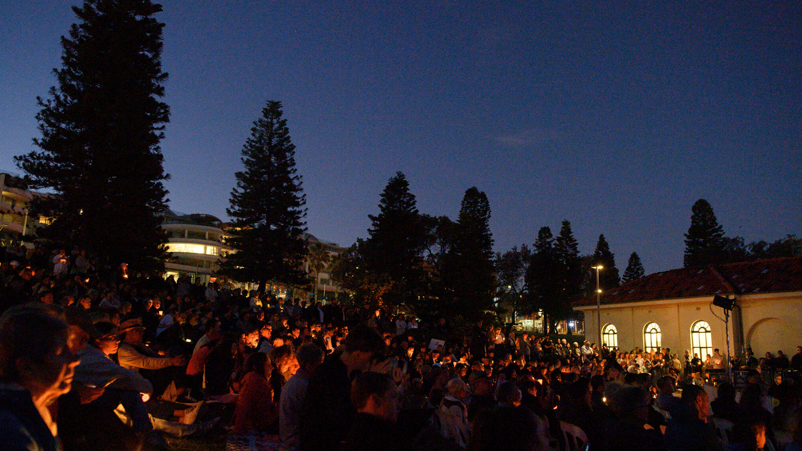 People attend a candlelight vigil for the victims of a stabbing attack at the Bondi Junction Westfield shopping centre in Sydney on April 21, 2024. (Photo: AFP)