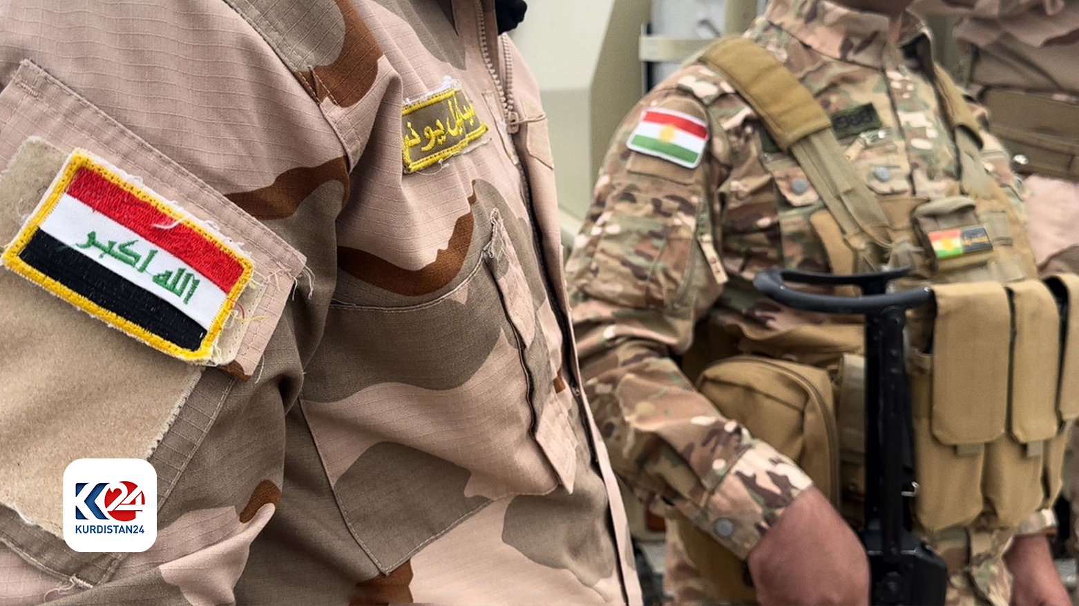 An Iraqi soldier (L) is pictured with a member of Kurdish Peshmerga forces (R) in Qaratapa-Hamrin Sector, Oct. 4, 2023. (Photo: Kurdistan 24)
