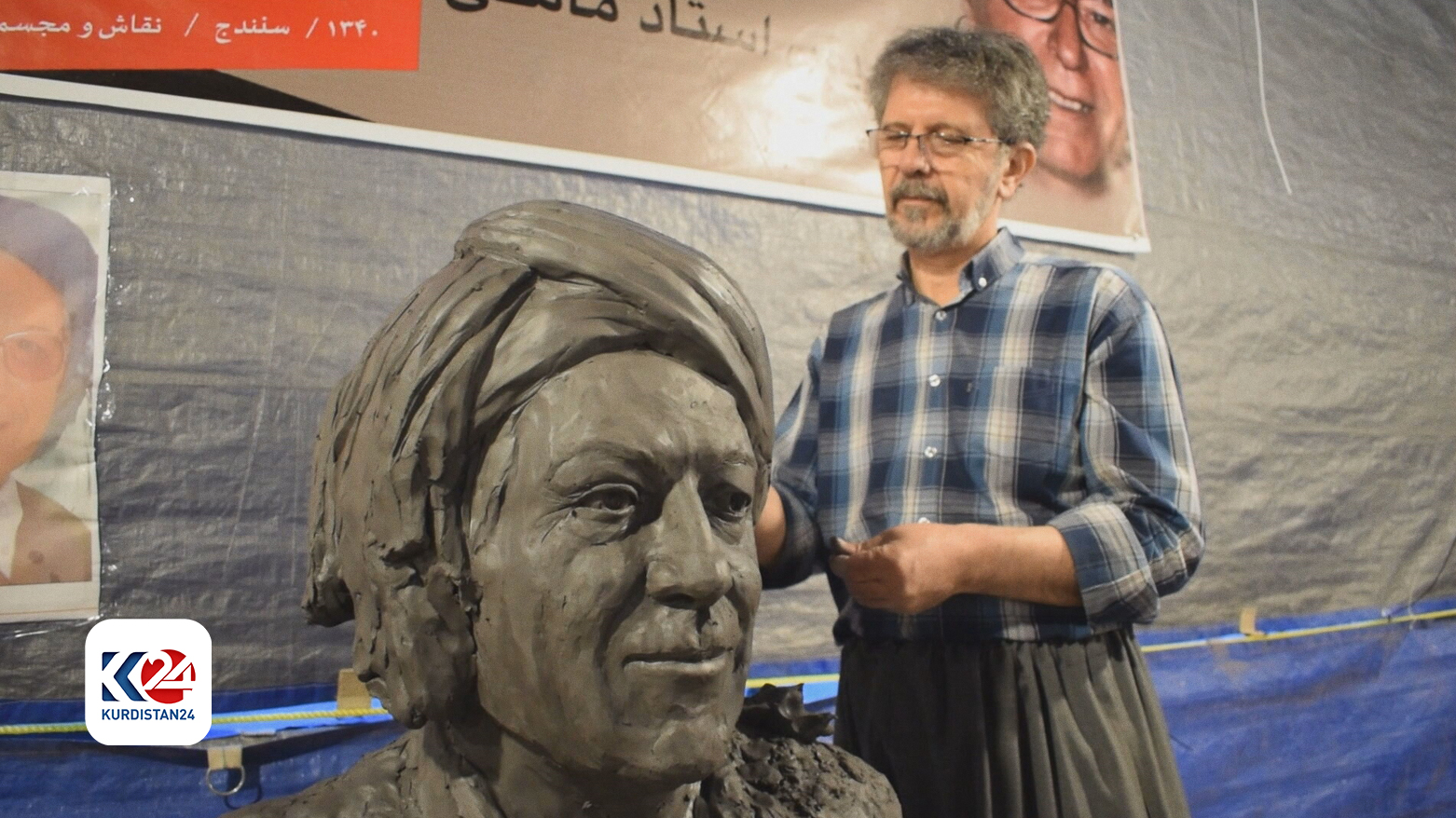 A sculptor working on a bust depicting Kurdish Musician and Singer Mohammad Mamle. (Photo: Kurdistan 24)