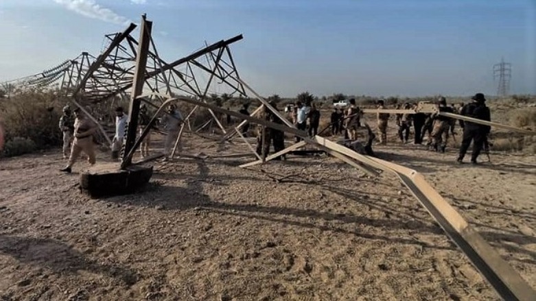 Security forces inspect a recently-downed electricity tower in the southern Iraqi province of Karabala, Aug. 12, 2021. (Photo: Social Media)