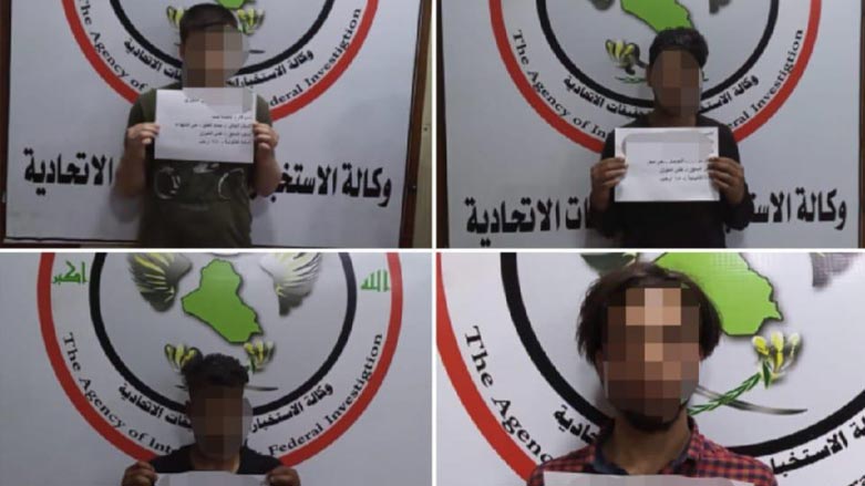 The blurred faces of the arrested terrorists. (Photo: Iraqi Media Cell)
