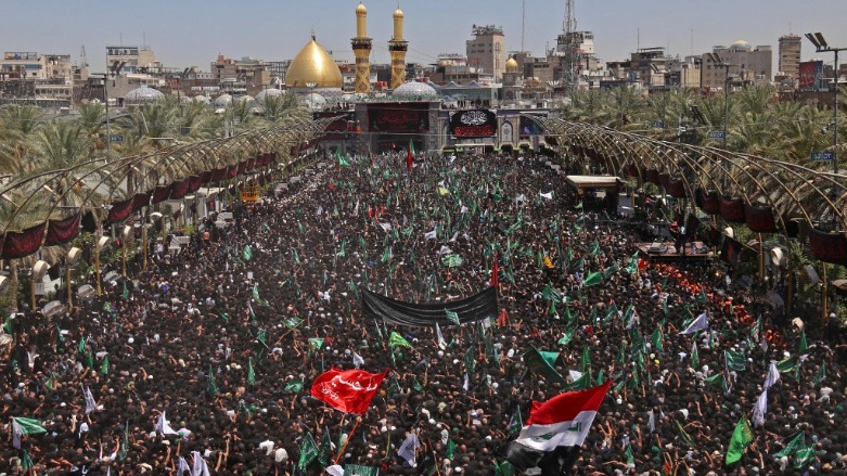 Shiite Muslim worshippers gather to mark the mourning day of Ashura, 10 Muharram according to the Islamic calendar at the Imam Hussein shrine in Iraq's holy city of Karbala, on August 19, 2021. (Photo: Mohammed Sawaf / AFP)
