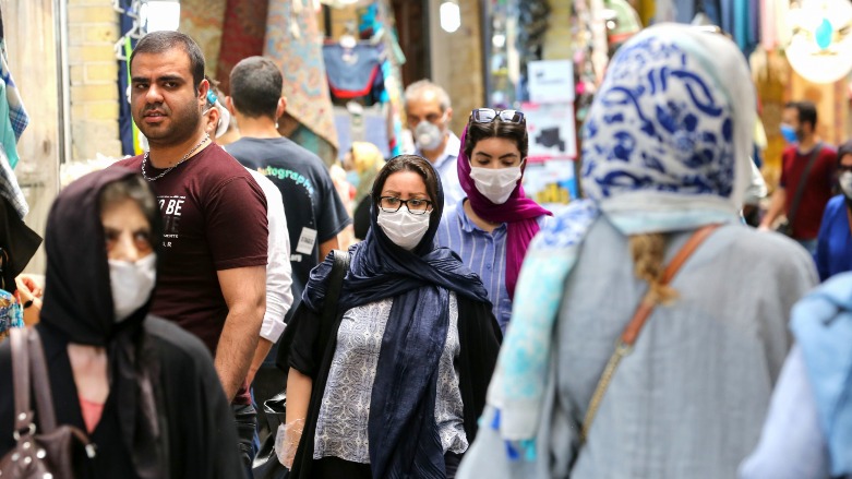 Iranians, some wearing protective gear amid the COVID-19 pandemic, shop at the Tajrish Bazaar market in the capital Tehran on July 14, 2020. (Photo: Atta Kenare/AFP)