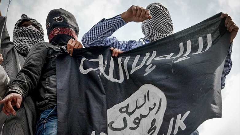 Members of the Islamic State-Khorsan hold the group's flag. (Photo: Tauseed Mustafa/AFP)