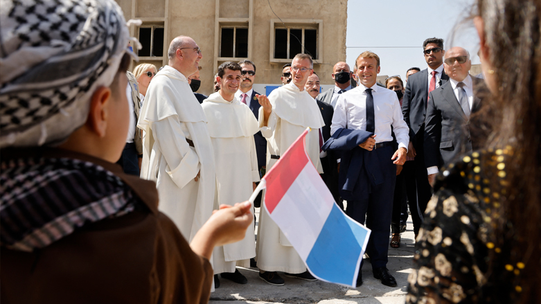 French President Emmanuel Macron (C-R) is welcomed upon his arrival at the Our Lady of the Hour Church in Iraq's second city of Mosul, August 29, 2021. (Photo: Ludovic/AFP)