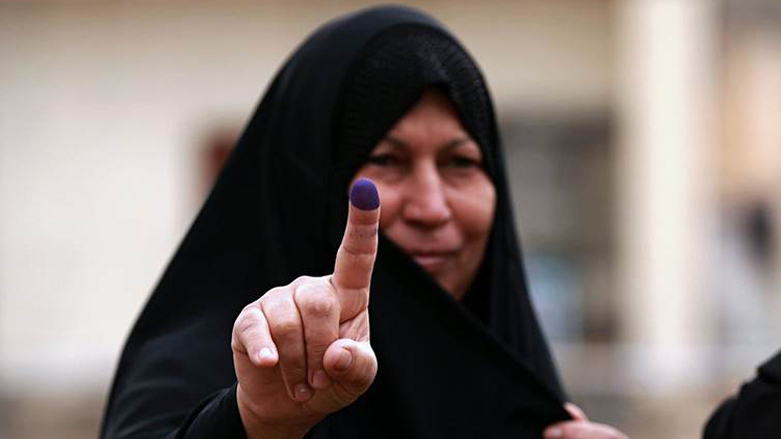 An Iraqi woman shows her inked-stained finger after casting her vote in the country’s parliamentary elections in Ramadi, Iraq, May 12, 2018. (Photo: Hadi Mizban/AP)