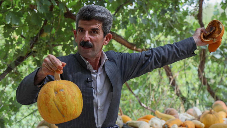 Kurdish farmer Azad Muhamad, known as the Halabja model farmer, displays organic fresh produce at his farm near Halabj, July 6, 2022. (Photo: Safin Hamed/AFP)