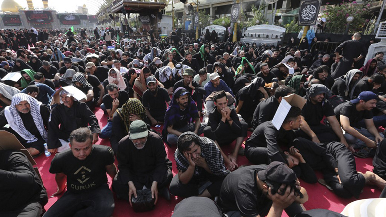 Shiite Muslims react as they listen to a retelling of the story of the seventh century killing of Prophet Mohammed's grandson Imam Hussein, August 9, 2022. (Photo: Sabah Arar/AFP)