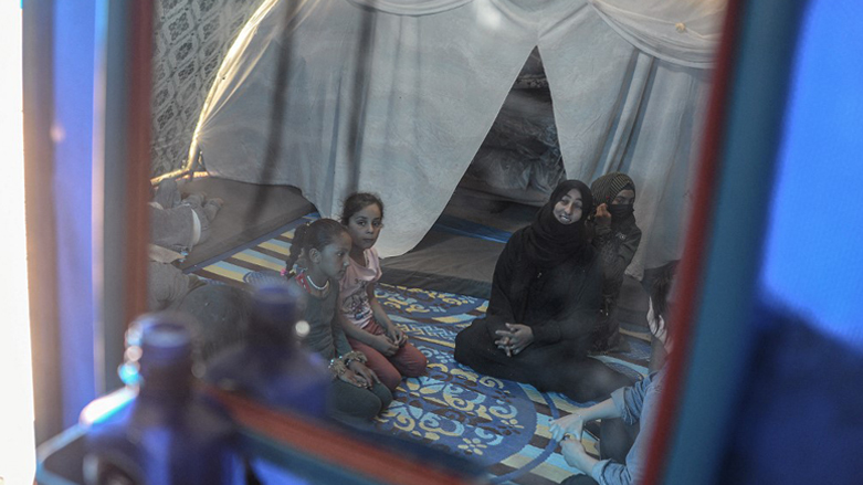 Displaced Iraqis sit in a tent at the Jadaa rehabilitation camp for the displaced near the northern Iraqi city of Mosul, on May 11, 2022. (Photo: Zaid Al-Obeidi/AFP)