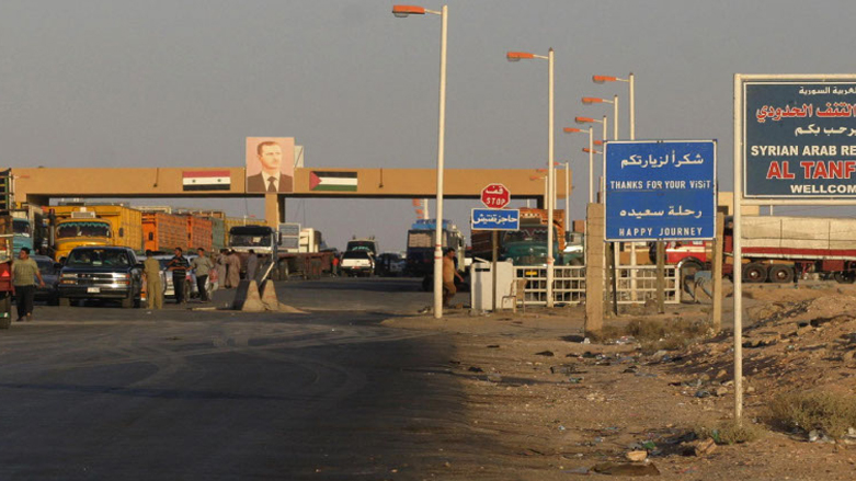 Cars wait at a checkpoint at the Syrian-Iraqi border point of al-Tanf, 167 miles northeast of Damascus, Syria, Oct. 2, 2004 (Photo: LOUAI BESHARA/AFP via Getty Images).