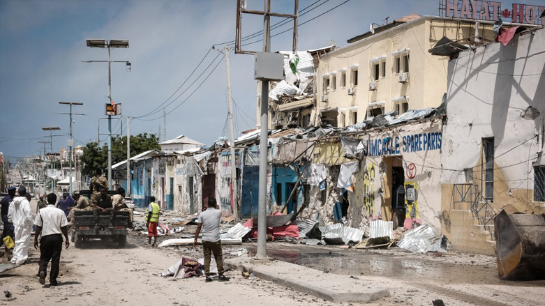 People watch outside of destroyed Hayat Hotel after a deadly 30-hour siege by Al-Shabaab jihadists in Mogadishu, August 21, 2022. (Photo: Hassan Ali Elmi/AFP)