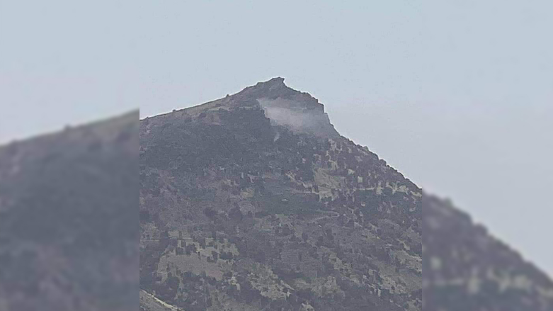 A photo showing white smoke billowing from a mountainous areas near Mawat of the Kurdistan Region's Sulaimani province, August 22, 2022. (Photo: Submitted to Kurdistan 24)