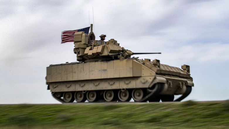 a US Bradley Fighting Vehicle (BFV) patrols the countryside of the Kurdish-majority city of Qamishli in Syria's northeastern Hasakeh province, April 20, 2022. (Photo: Delil Souleiman/AFP)