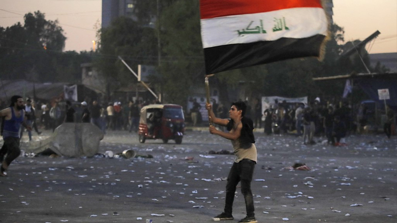 A supporter of Iraqi Shiite cleric Moqtada Sadr waves the Iraqi flag in the capital Baghdad, August 29, 2022. (Photo: Ahmad Al-Rubaye/AFP)