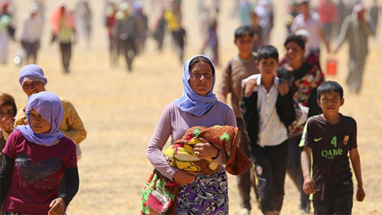 أثناء فرار الإيزيديين من سنجار خلال اجتياح داعش عام 2014 (تعبيرية)