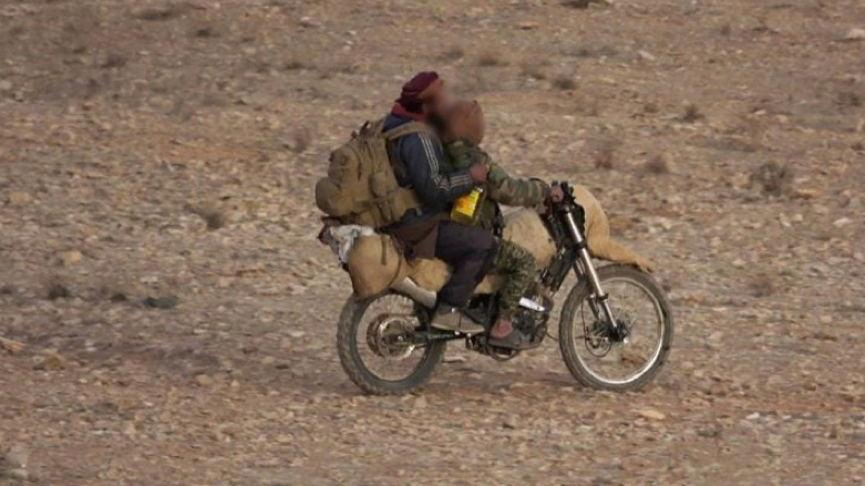 Men riding a motorcycle in Deir ez-Zor (Photo: SOHR)