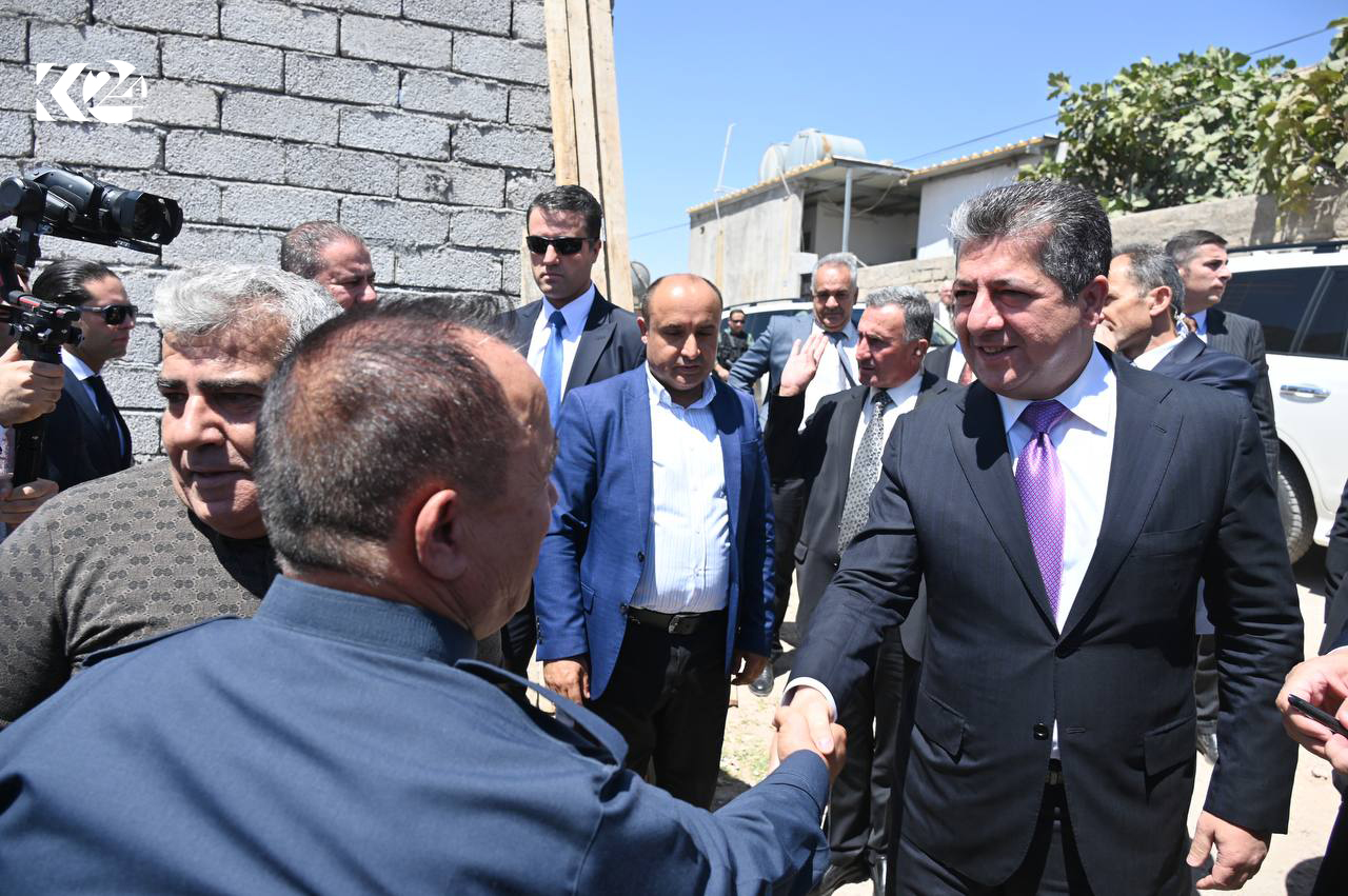 Kurdistan Region Prime Minister Masrour Barzani (right) shaking hands with a local resident in a Duhok neighborhood, August 14, 2023. (Photo: KRG)