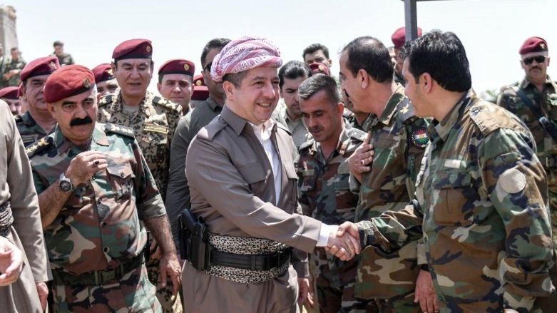 Kurdistan Region Prime Minister Masrour Barzani shaking hands with members of Peshmerga forces. (Photo: KRG)