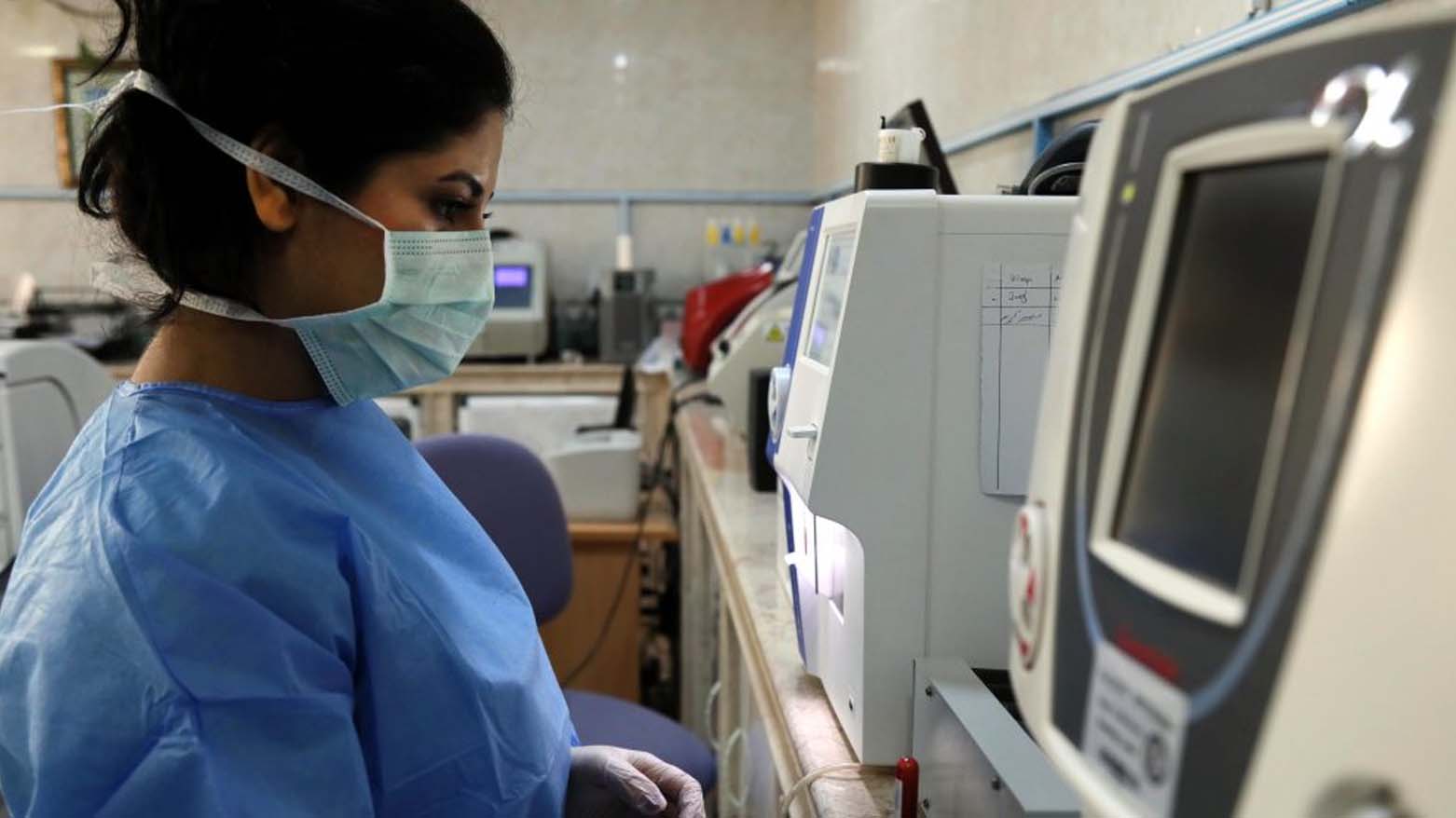 A Kurdish health care worker at lab in Kurdistan Region, July 27, 2021. (Photo: AFP)