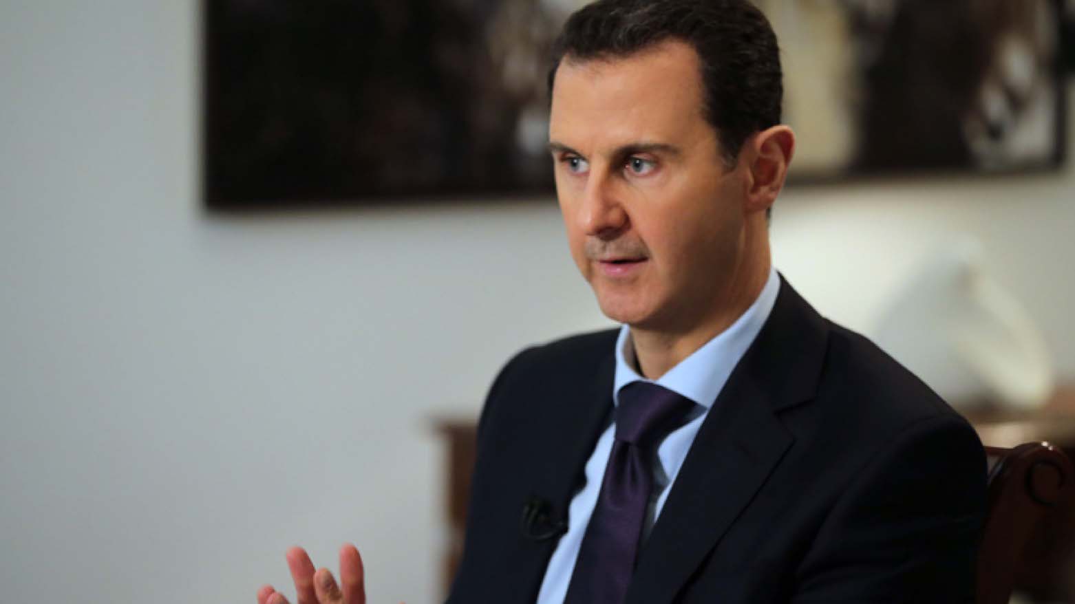 Syrian President Bashar al-Assad gestures during an interview with AFP in the capital Damascus on February 11, 2016 (Photo: AFP/JOSEPH EID/Getty Images)