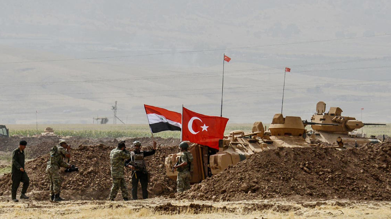 Iraqi and Turkish soldiers stand next to tanks carrying Turkish and Iraqi flags during a joint military exercise near the Turkish-Iraqi border at Silopi district in Sirnak, September 26, 2017. (Photo: AFP)
