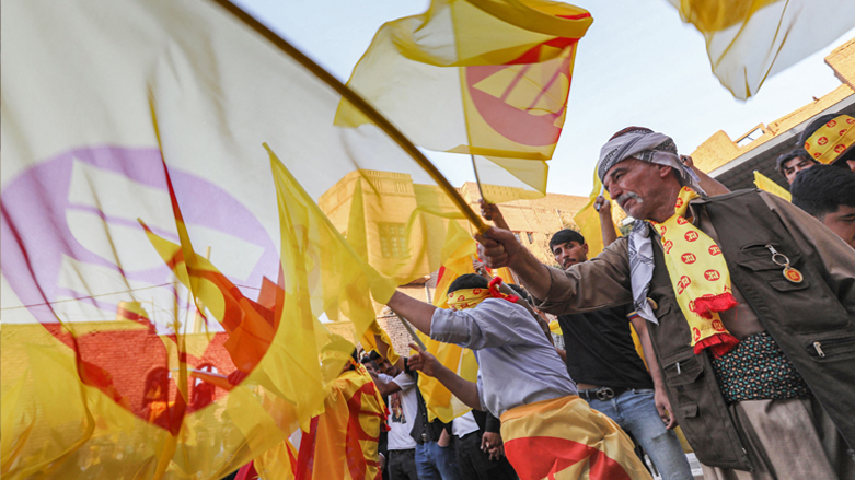 KDP supporters wave their party's flag at an election rally near Erbil's citadel, Oct. 7, 2021. (Photo: Safin Hamid/AFP)