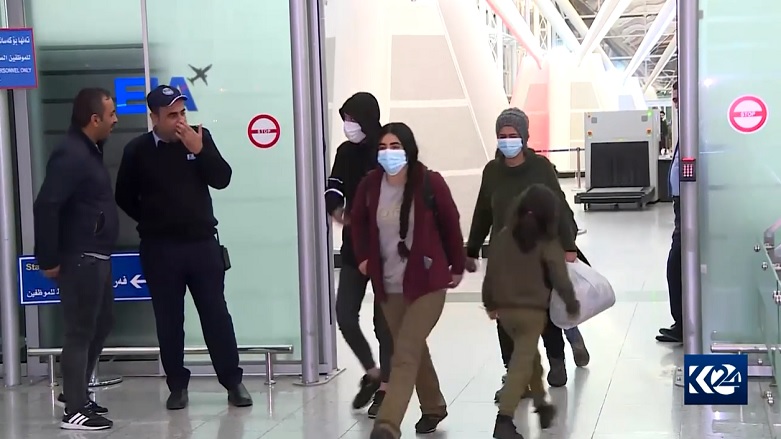 Would-be migrants to Europe who spent weeks stranded on the border of Belarus arrive at Erbil International Airport, Dec. 2, 2021. (Photo: Kurdistan 24)