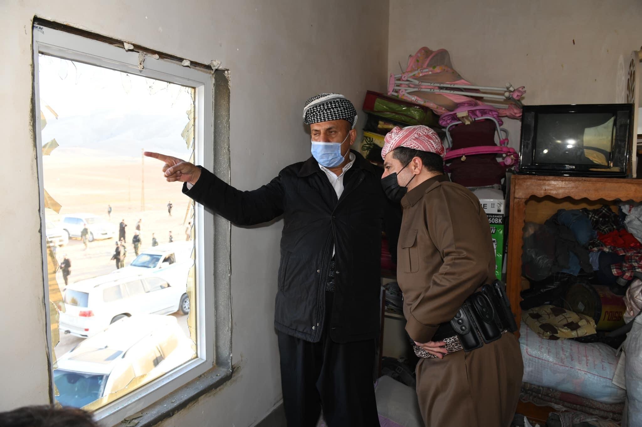 Father of three killed brothers (left) shows PM Barzani the damages his house suffered as a result of clashes between his sons and ISIS militants on Thursday night, Dec. 3, 2021. (Photo: KRG)