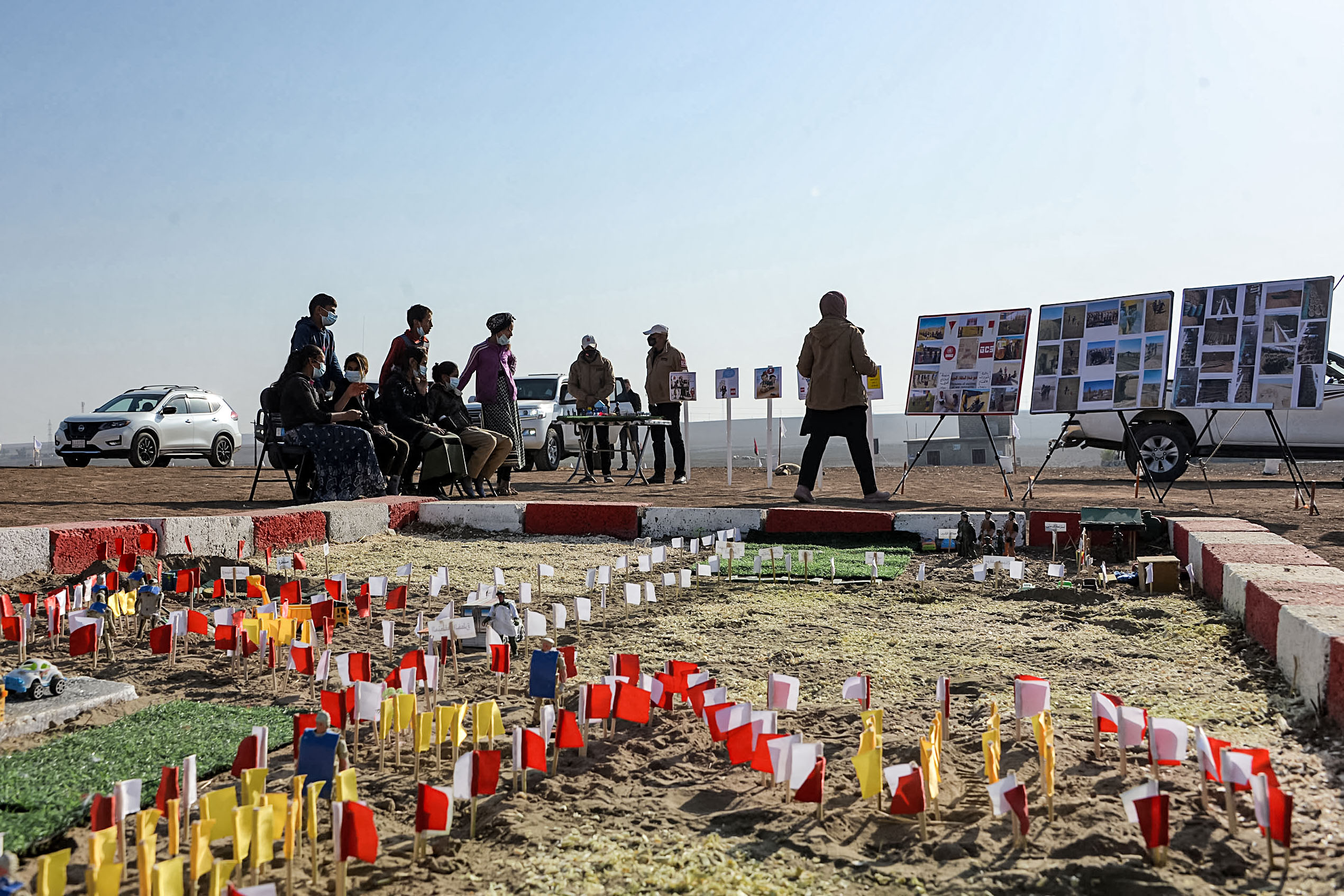 An instructor of Global Clearance Solutions (GCS) private demining company gives a workshop to children on how to report suspected cases of landmines and unexploded ordnances, Nov. 29, 2021. (Photo: Zaid al-Obeidi/AFP)