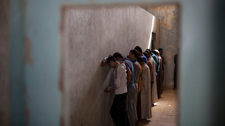 ISIS suspects are lined up for screening in Iraq. (Photo: Bram Janssen/AP)
