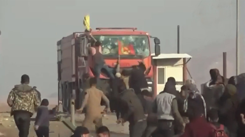 The Kurdistan Workers' Party (PKK) attacking the Kurdistan Region's Faysh Khabur border crossing office with northeast Syria, Dec. 15, 2021. (Photo: ANHA TV screengrab)