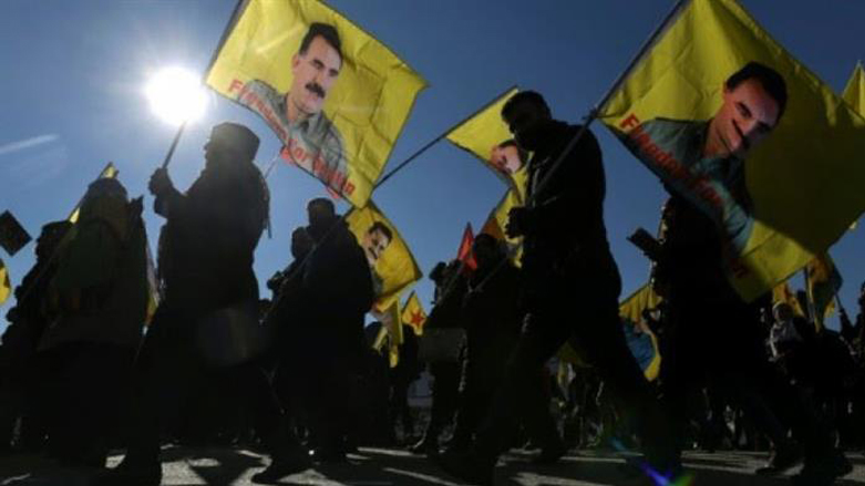 PKK members and supporters waving flags with portrait of their leader Abdullah Ocalan. (Photo: AFP)