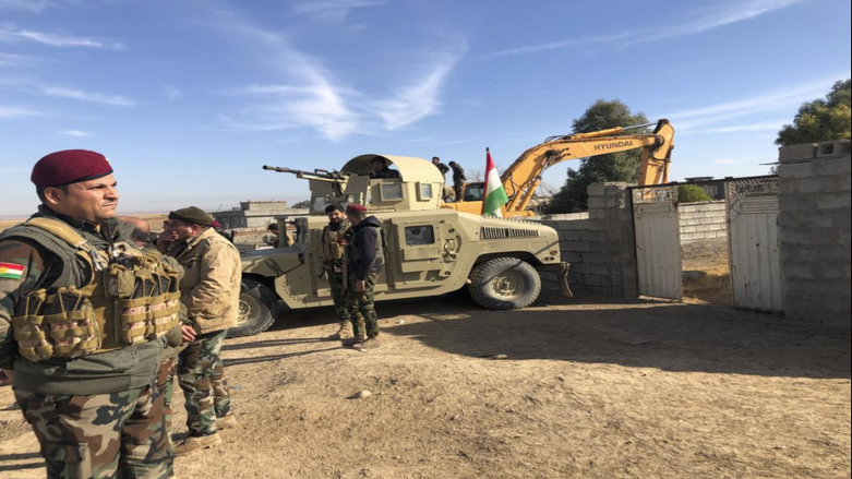 Kurdish Peshmerga forces oversee digging of defensive trenches in the village of Lheiban , Iraq, Tuesday, Dec. 7, 2021. (Photo: Samya Kullab/AP)