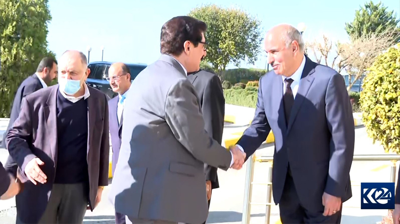 Imad Ahmed (right), top PUK official, shakes hand with Fazil Mirani, a senior KDP official, in Sulaimani, Dec. 19, 2021. (Photo: Screengrab/Kurdistan 24)