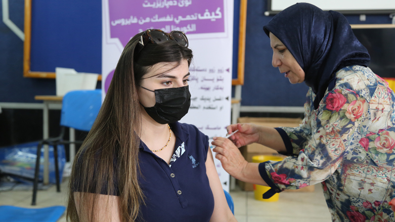 A woman is pictured receiving a COVID-19 vaccine in the Kurdistan Region's Sulaimani province, July 27, 2021. (Photo: Dana Hama Gharib/Kurdistan 24)