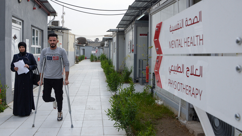 A patient walks in an alley at the Al-Wahda hospital, opened by Doctors Without Borders (MSF) in 2018, in Iraq's northern city of Mosul, Dec. 16, 2021. (Photo: Zaid al-Obeidi/AFP)