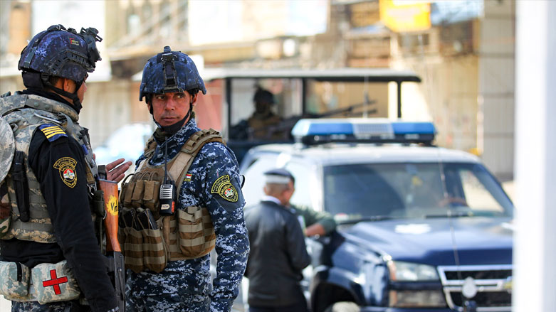أفراد من الشرطة الاتحادية العراقية في الصورة أثناء أداء واجبهم، 29 يناير/كانون الثاني 2021. (الصورة: وكالة الصحافة الفرنسية/أحمد الربيعي)
