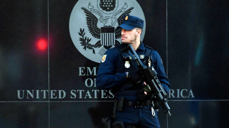 A Spanish police officer stands guard near the U.S. Embassy in Madrid on Thursday (Photo: Oscar del Pozo / AFP - Getty Images)