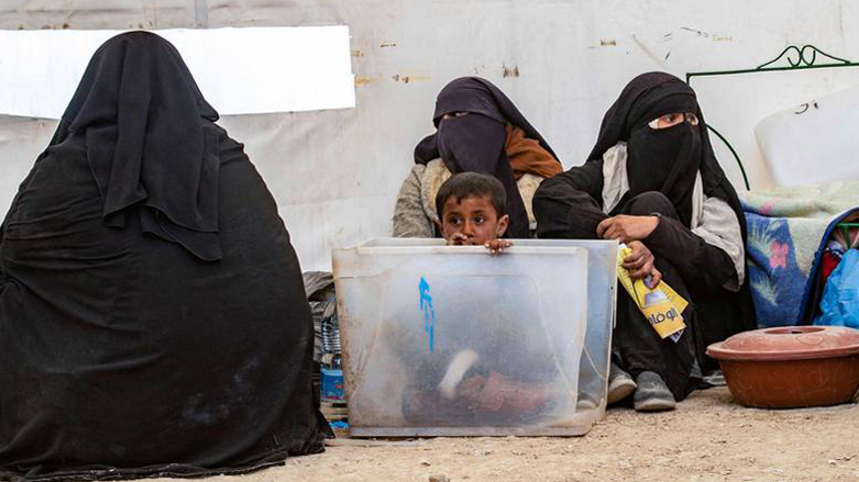 Veiled women and a child in northeastern Syria's al-Hol camp. (Photo: Delil Souleiman/AFP)